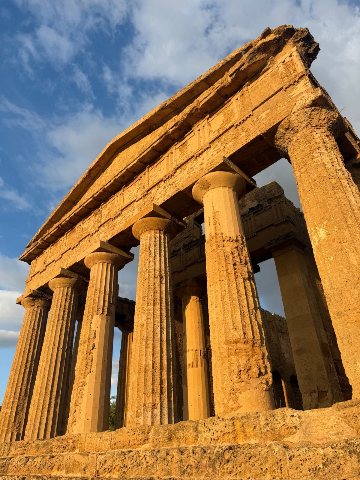 A Greek temple of golden columns glowing in the evening light at Agrigento